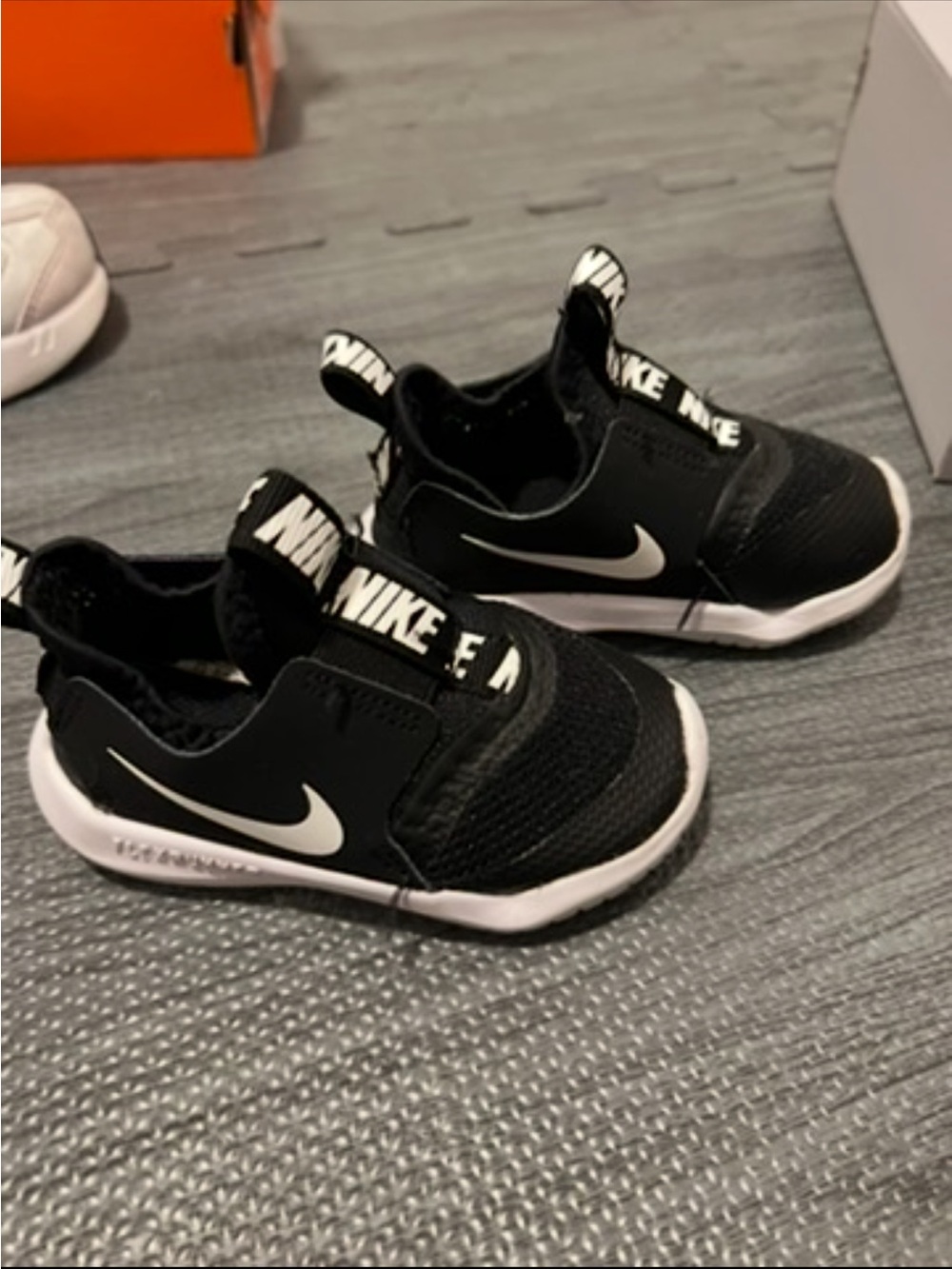 Nike Kids Black and White Slip-On Sneaker with Swoosh